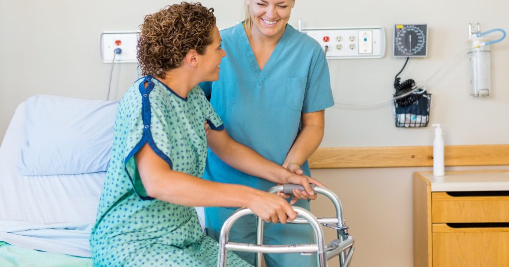 "Photo of a nurse providing round-the-clock care to a patient in a hospital room."