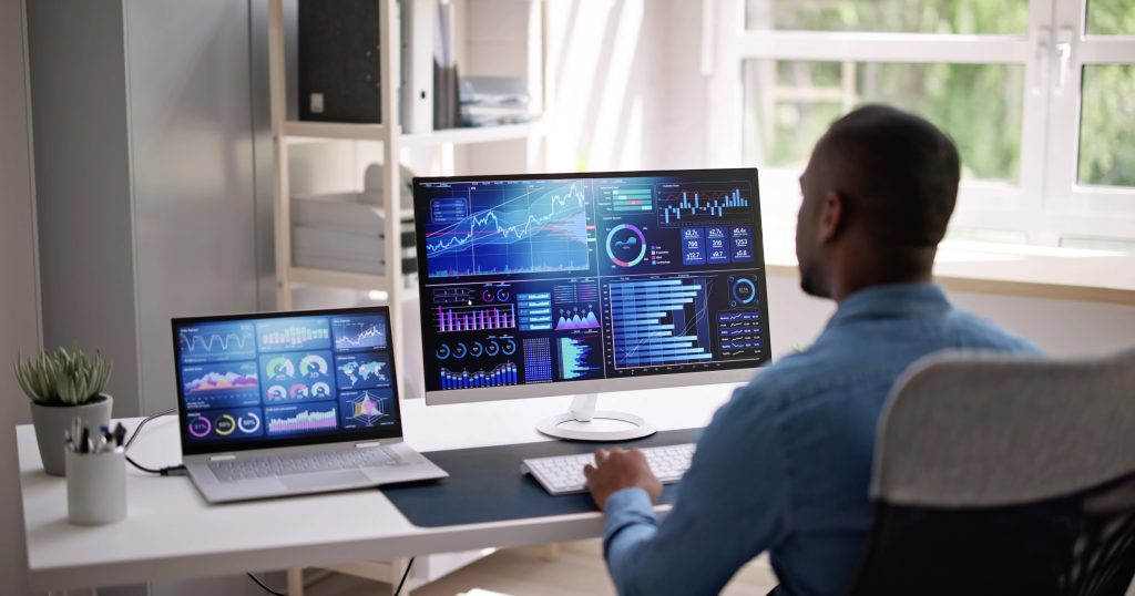 "Analytics Dashboard Displaying Key Metrics" "Computer screen displaying various analytics dashboards with charts and graphs."