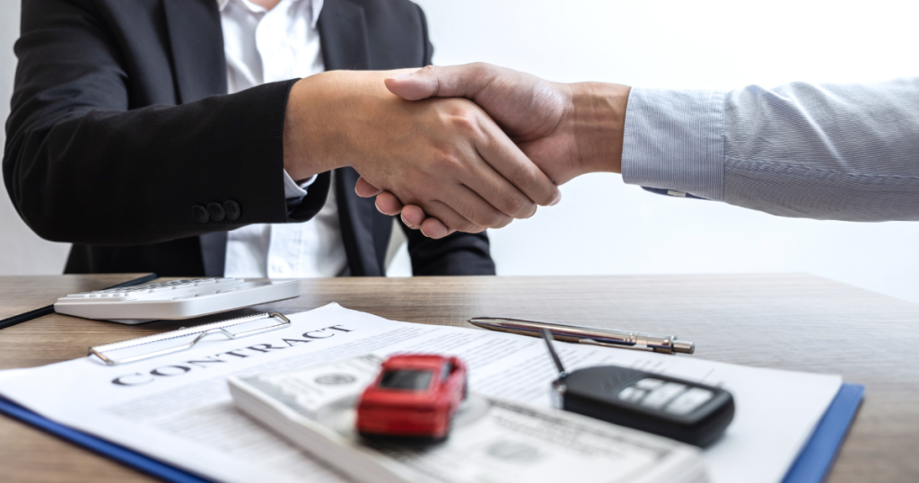 COBRA Coverage: Enrolling with Professional Guidance Photo of a handshake between an individual and an insurance agent.