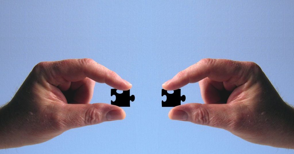 "Cohesive Core Competencies: Fitting Pieces Together" "Completed jigsaw puzzle pieces fitting together seamlessly, representing cohesive core competencies."