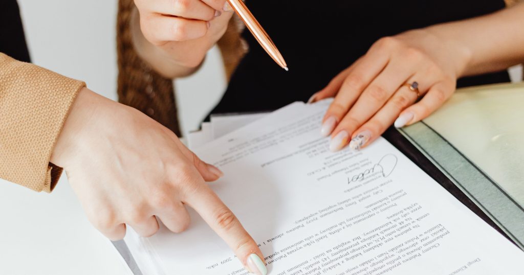 "Overwhelming Stack of Medical Bills and Paperwork" "Large stack of medical bills and paperwork representing the overwhelming administrative burden on healthcare providers."
